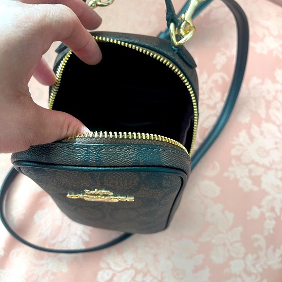 Coach cross body bag holds phone and wallet and a little snack comfortably - Picture 2 of 3